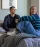 friends sitting on a bed