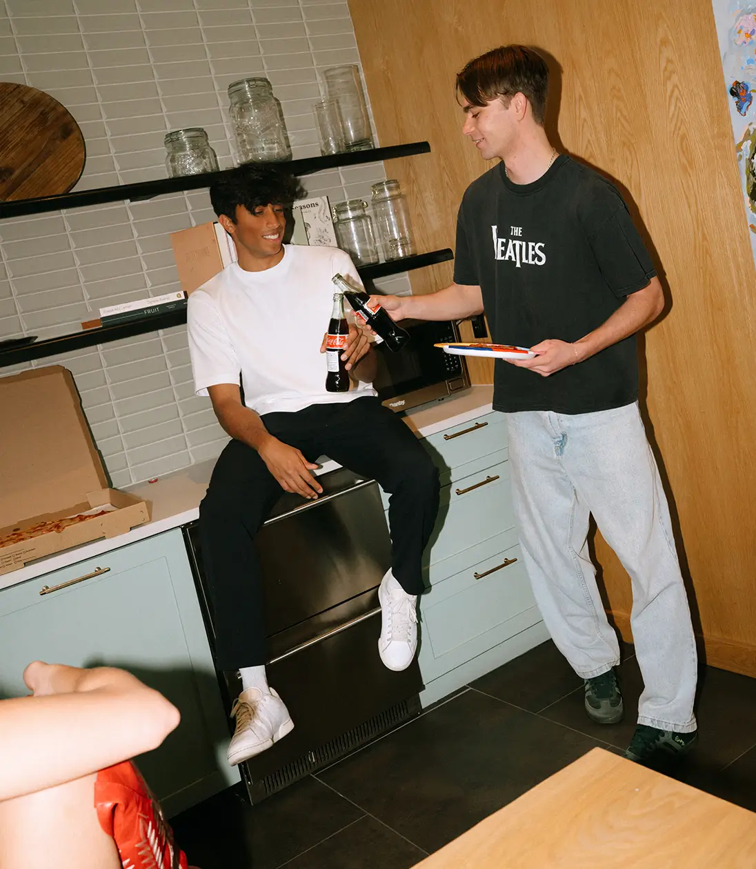 two friends drinking soda