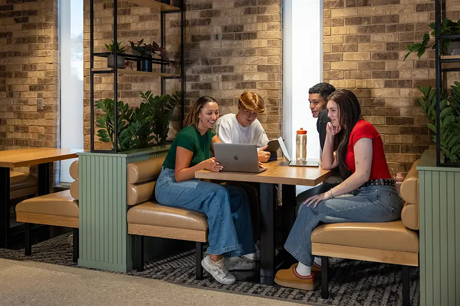 friends looking at a laptop