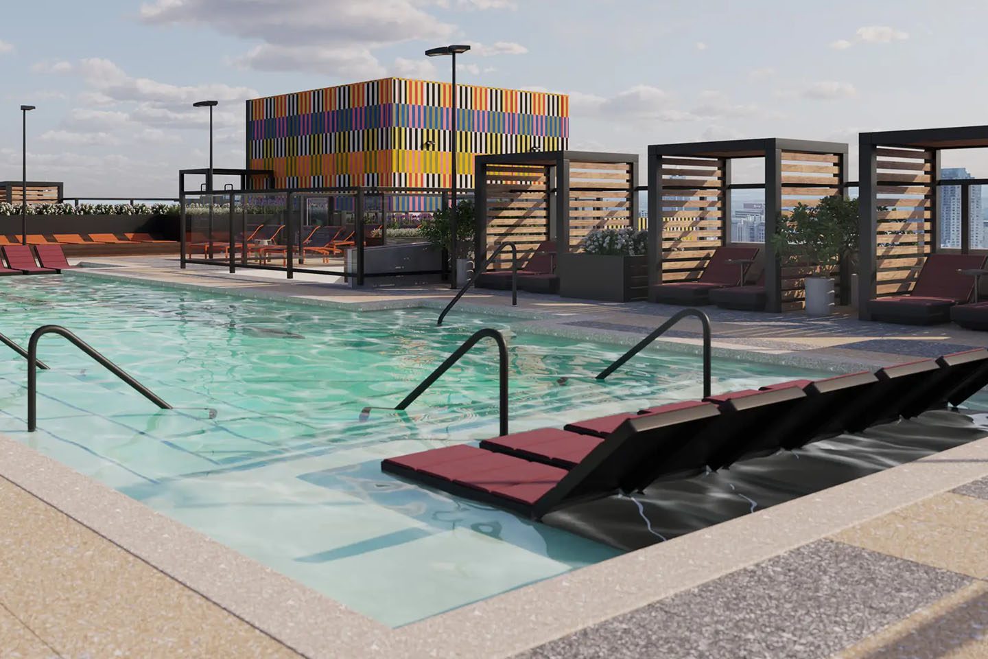 Large rooftop pool with several seating options.